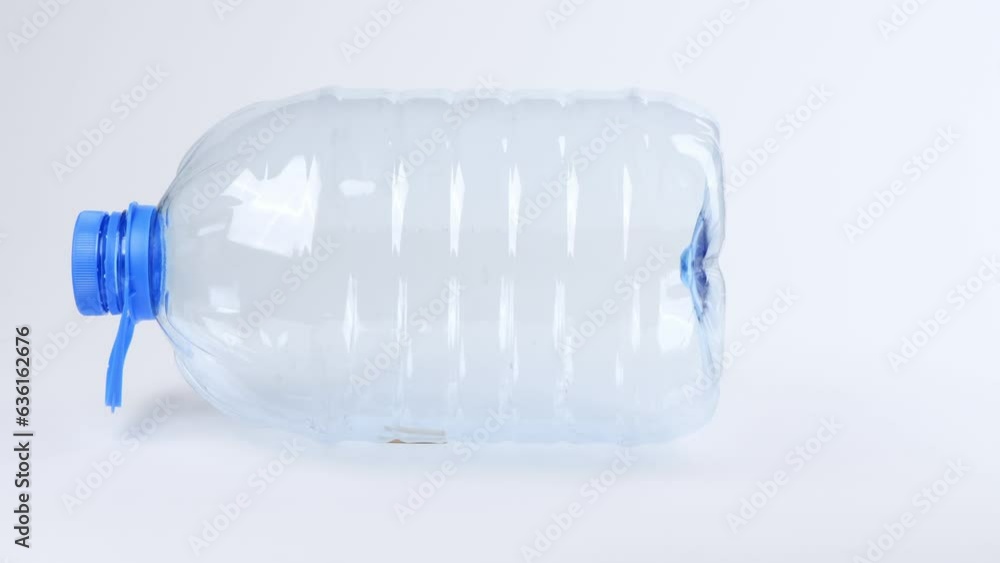 Plastic bottle on white. Side view. Loop motion. Rotation 360. 4K UHD video footage 3840X2160. Plastic bottle on white. Side view. Loop motion. Rotation 360. 4K UHD video footage 3840X2160.