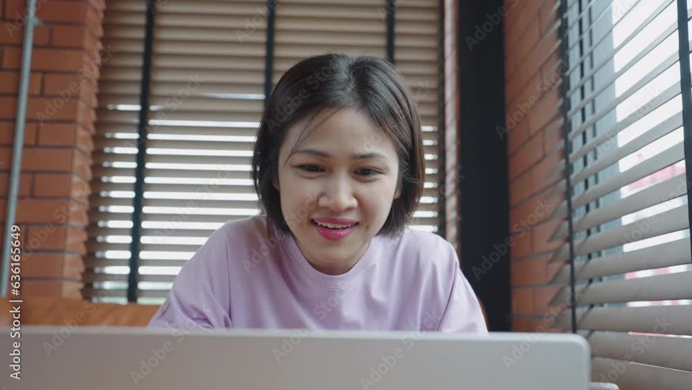 Young asian student woman using video conference call on laptop during remote online class, studying using laptop Young asian student woman using video conference call on laptop during remote online class, studying using laptop