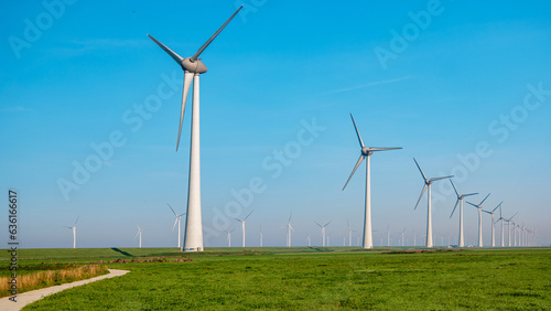 windmill park in the ocean aerial view with wind turbine Flevoland Netherlands Ijsselmeer. Green Energy in the Netherlands