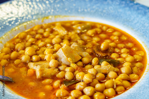 chickpeas with chorizo and bacon, typical spanish dish, tapas photo