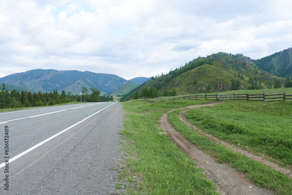 rural road in the mountains. Altai, Siberia, Russia