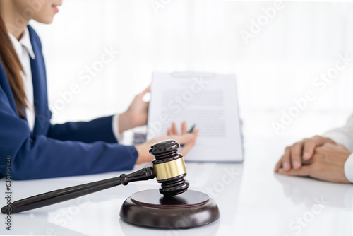 Photography Professional Female lawyer or counselor discussing negotiation legal case with client meeting with document contract in office, law and justice, attorney, lawsuit concept