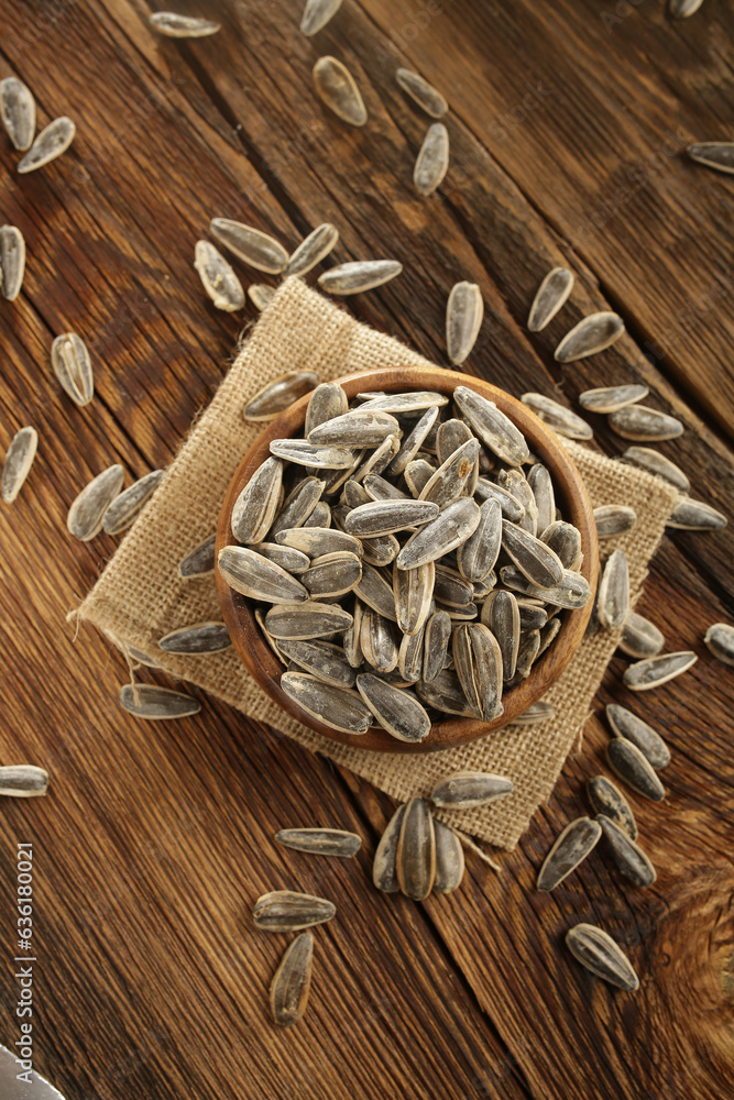 DRİED NUTS AND FRUİTS IN WOODEN BOWL ON BROWN FLOOR DRİED NUTS AND FRUİTS IN WOODEN BOWL ON BROWN FLOOR