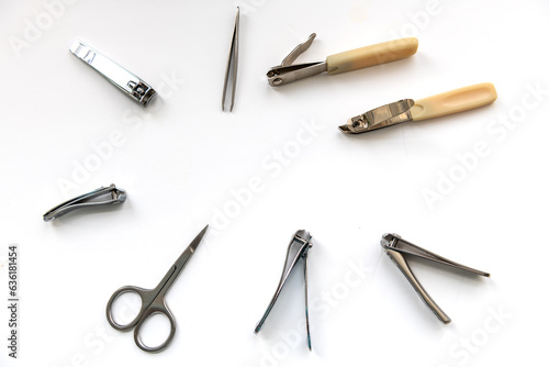 Nail clippers and scissor isolated in white.