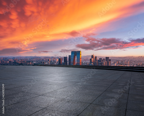 Empty floor and modern city skyline with building at sunset in Suzhou, China. high angle view.