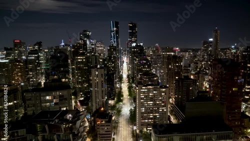 Aerial view of Downtown Vancouver, BC, at night, busy city street hyper lapse, high rise buildings, corporate office, city at night. 4K 24FPS PRORES 422