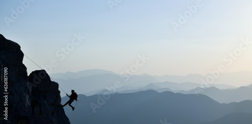 Young Man Doing Tough Rock Climbing
 photo