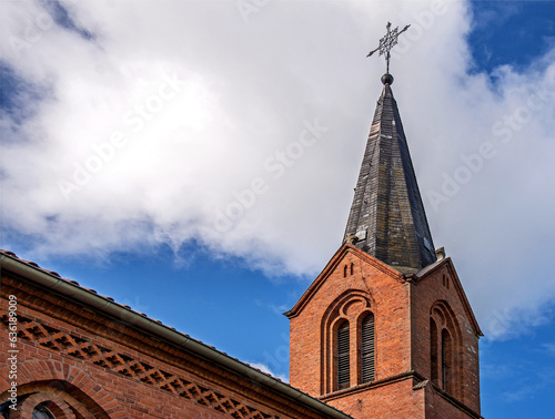 Fototapeta Naklejka Na Ścianę i Meble -  General view and close-up architectural details of the Catholic Church of St. Holy Trinity in the town of Dwawrzuty in Masuria in Poland.