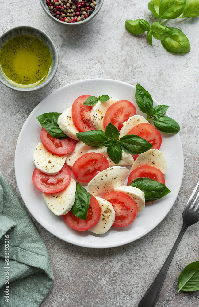 Caprese salad with tomatoes, mozzarella and basil. Caprese salad with tomatoes, mozzarella and basil.