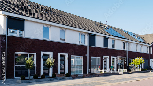 Dutch Suburban area with modern family houses, newly build modern family homes in the Netherlands, dutch family house in the Netherlands, Street with modern family houses in urban suburb  © Chirapriya