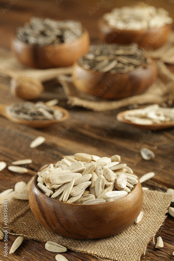 DRİED NUTS AND FRUİTS IN WOODEN BOWL ON BROWN FLOOR DRİED NUTS AND FRUİTS IN WOODEN BOWL ON BROWN FLOOR