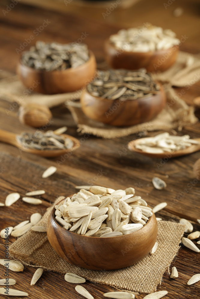 Fototapeta premium DRİED NUTS AND FRUİTS IN WOODEN BOWL ON BROWN FLOOR