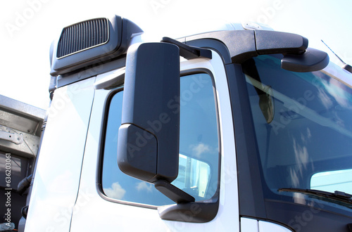 Rear-view mirror on the truck. Large rear view mirror on the truck cab. Heavy truck side rear view mirror. Side view mirror truck. © Best Auto Photo