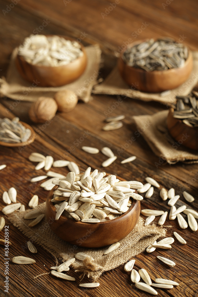 Fototapeta premium DRİED NUTS AND FRUİTS IN WOODEN BOWL ON BROWN FLOOR