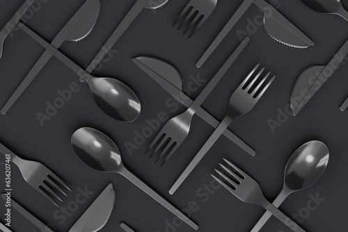 Set of disposable utensils like spoon, fork and knife on monochrome background. photo