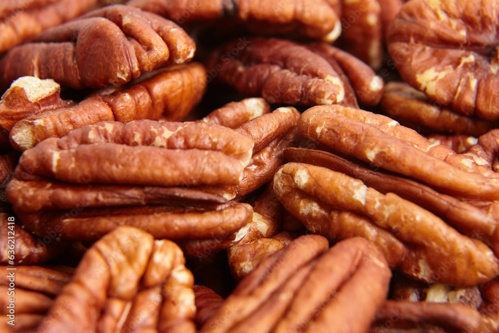 Pecan nuts kernel texture background closeup. Heap of peeled pecan halves. Pecan halves, a puzzle of nutty goodness Pecan nuts kernel texture background closeup. Heap of peeled pecan halves. Pecan halves, a puzzle of nutty goodness