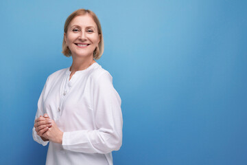 beautiful cute blond middle aged woman in white blouse in premenopausal age