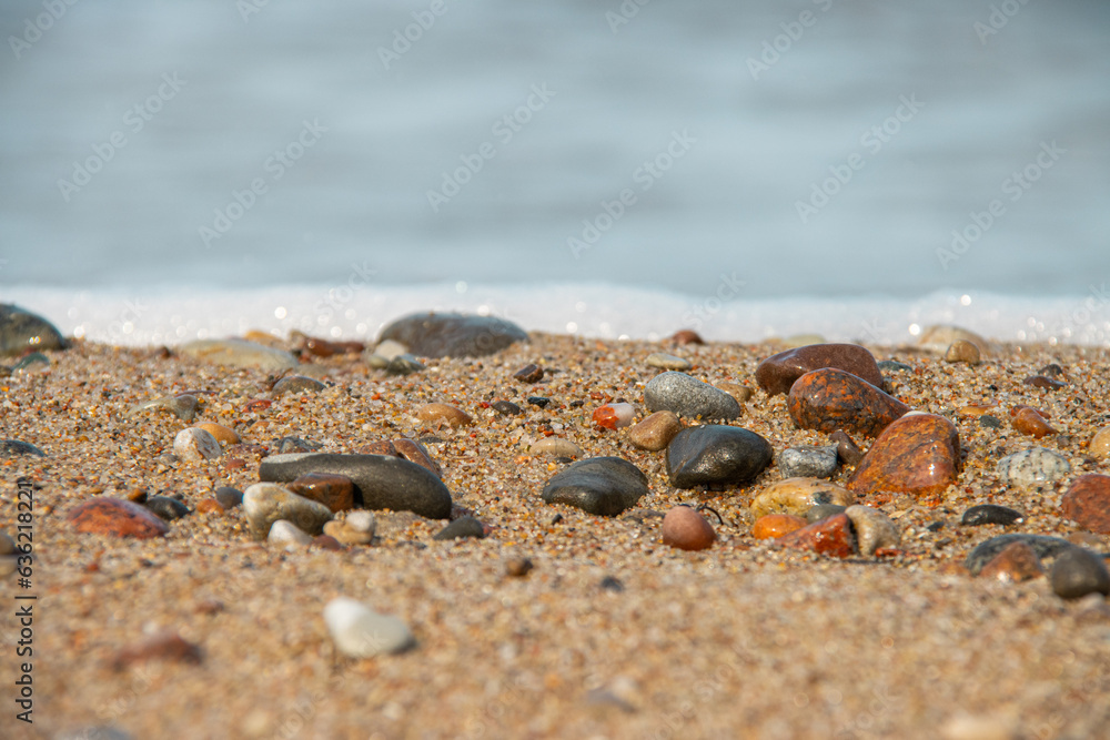 Close-up view of the sand with small stones on the seashore Close-up view of the sand with small stones on the seashore