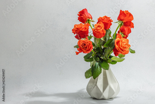 Bouquet of fresh bright roses on vase. Romantic gift concept, greeting card. Valentines, Woman's Day