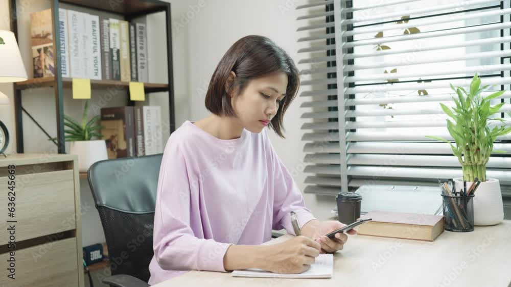 Financial analyst Asian Woman calculate Budget on Financial planning and making notes at home Financial analyst Asian Woman calculate Budget on Financial planning and making notes at home