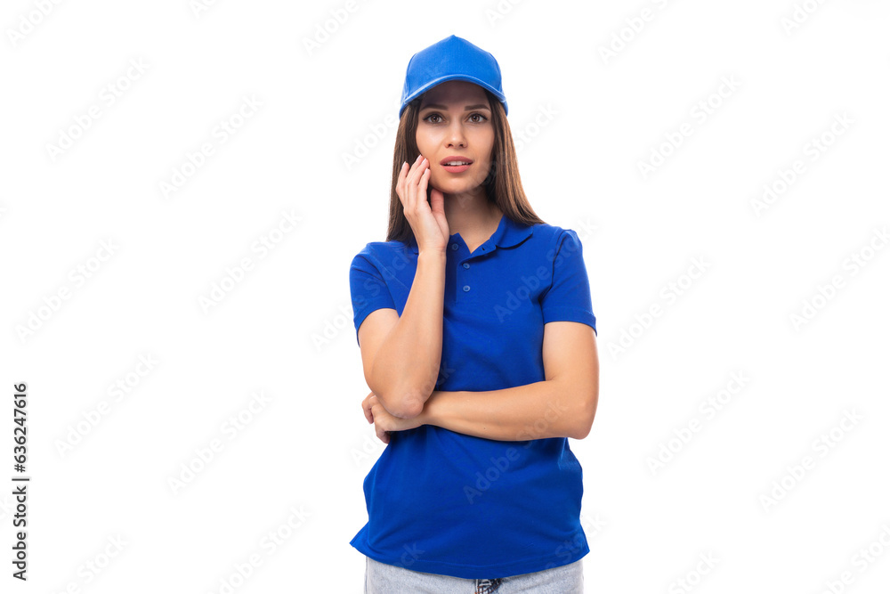 beautiful pretty young caucasian brunette woman in uniform t-shirt and cap on white billboard background beautiful pretty young caucasian brunette woman in uniform t-shirt and cap on white billboard background