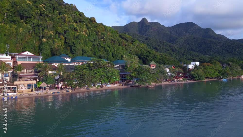 Smooth aerial top view flight drone. Village Beach Resort Hotels, hilly island Smooth aerial top view flight drone. Village Beach Resort Hotels, hilly island