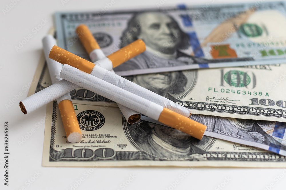 100 Dollars banknote with tobacco cigarettes, danger lifestyles 100 Dollars banknote with tobacco cigarettes, danger lifestyles