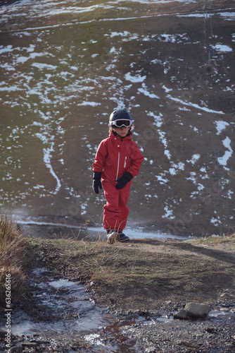 Fototapeta Naklejka Na Ścianę i Meble -  Boy walking in mountains on spring day