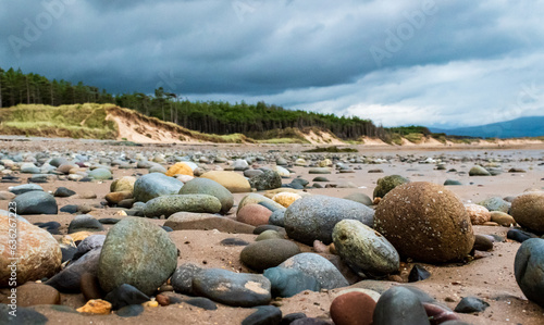 Rocks on the beach at Newborough beach, Angelsey, Wales, UK photo