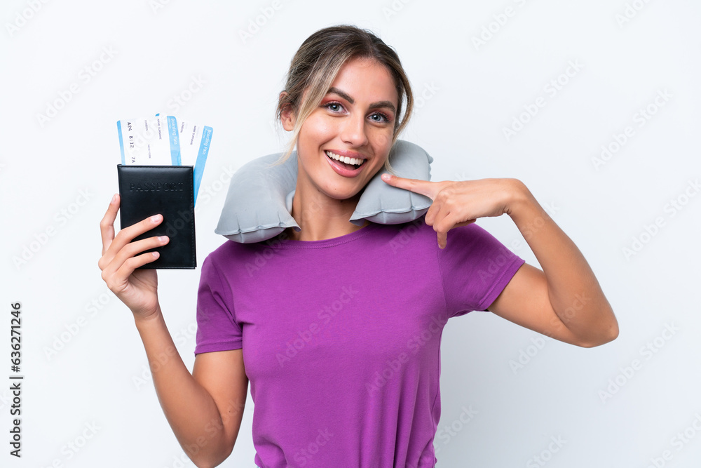 Young pretty Uruguayan woman with Inflatable Travel Pillow isolated on white background giving a thumbs up gesture Young pretty Uruguayan woman with Inflatable Travel Pillow isolated on white background giving a thumbs up gesture