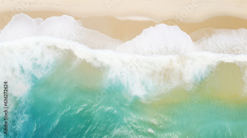 Overhead photo of crashing waves on the shoreline beach. Tropical beach surf. Abstract aerial ocean view