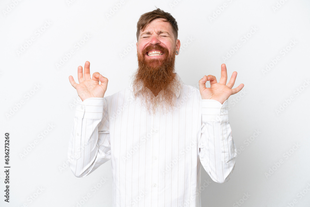 Redhead man with long beard isolated on white background in zen pose Redhead man with long beard isolated on white background in zen pose