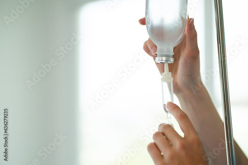 person holding a glass of water