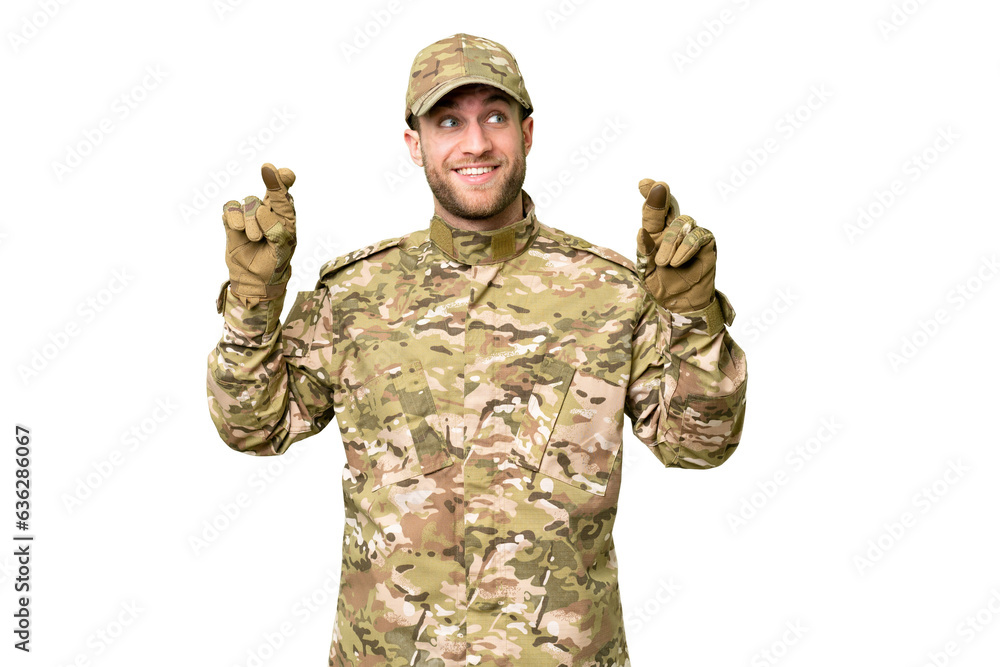 Military man over isolated chroma key background with fingers crossing Military man over isolated chroma key background with fingers crossing