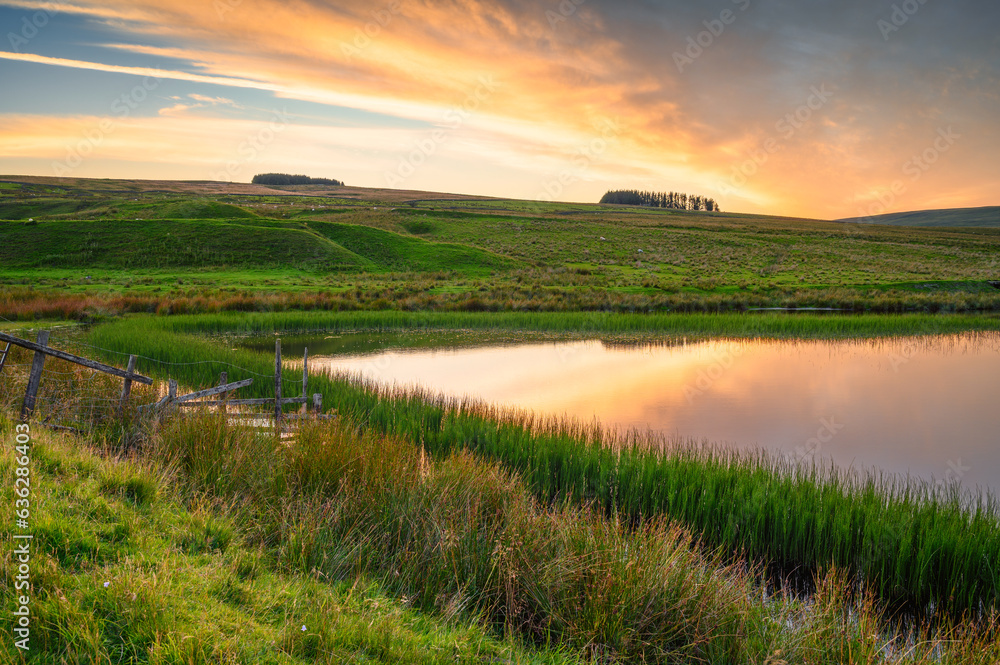 Sunset at Westgate Tarn, also called West Slitt Dam and used in the nearby old Lead Mine at Weardale, County Durham in the North Pennines AONB