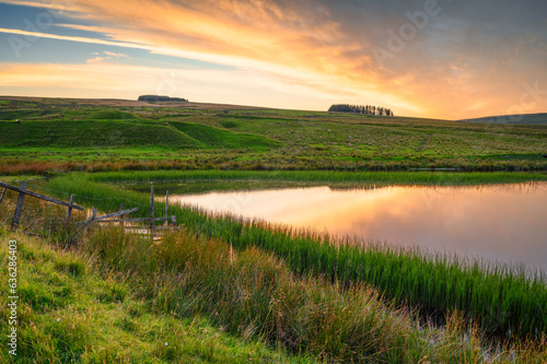 Sunset at Westgate Tarn, also called West Slitt Dam and used in the nearby old Lead Mine at Weardale, County Durham in the North Pennines AONB photo