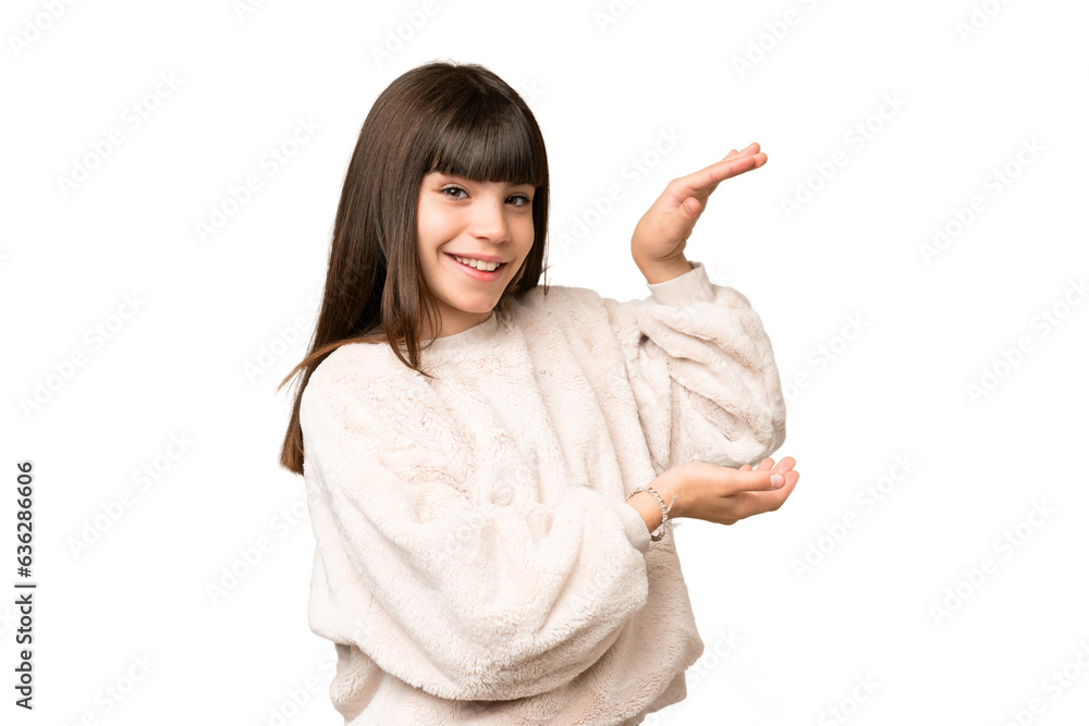 Little girl over isolated green chroma key background holding copyspace to insert an ad Little girl over isolated green chroma key background holding copyspace to insert an ad