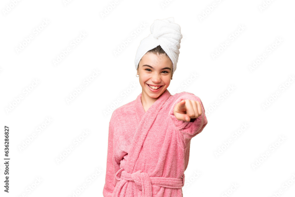 Little girl in a bathrobe over isolated chroma key background points finger at you with a confident expression Little girl in a bathrobe over isolated chroma key background points finger at you with a confident expression