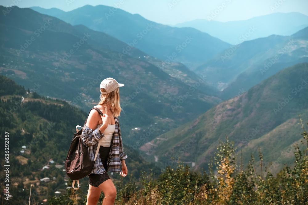 Travel.Freedom, The girl travels through the mountains of wild nature. Unity, mental health, eco travel. Hiking, travel, good times, digital detox, self care,eco travel to the mountains