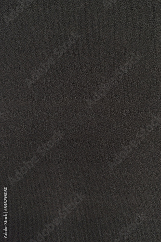 Detailed texture of black woolen cloth surface. Abstract background or texture. Blank for design