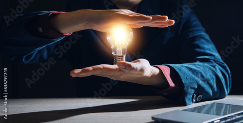 Creative new idea. Innovation, brainstorming, inspiration and solution concepts. The man is holding light bulb. Copy space background.