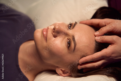 Wellness center client getting relaxing scalp massage