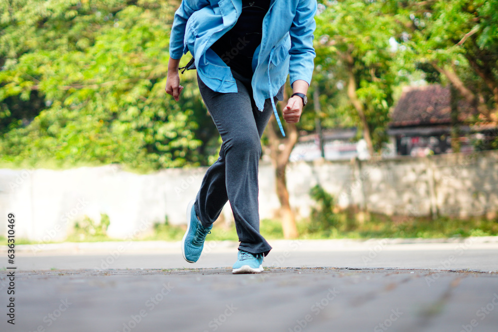 Side view of a jogger legs running. Workout and healthy life concept