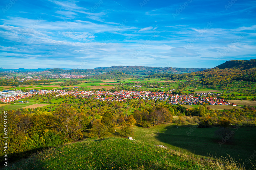 Germany, view above swabian alb nature landscape bissingen unter teck city houses sunny day autumn colorful blue sky