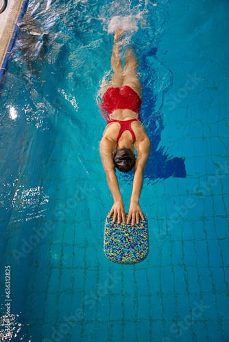Photography Swimmer doing flutter kicks in swimming pool