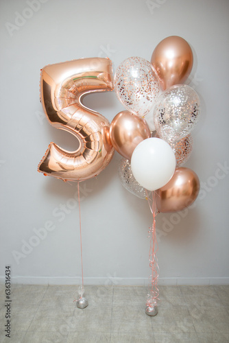 balloons for 5 years, helium balloons in rose gold color on a white background, 5 years