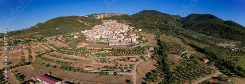 Tremendous aerial Panoramic view of Penyarroya de Tastavins Village among mountains in Teruel, Spain photo