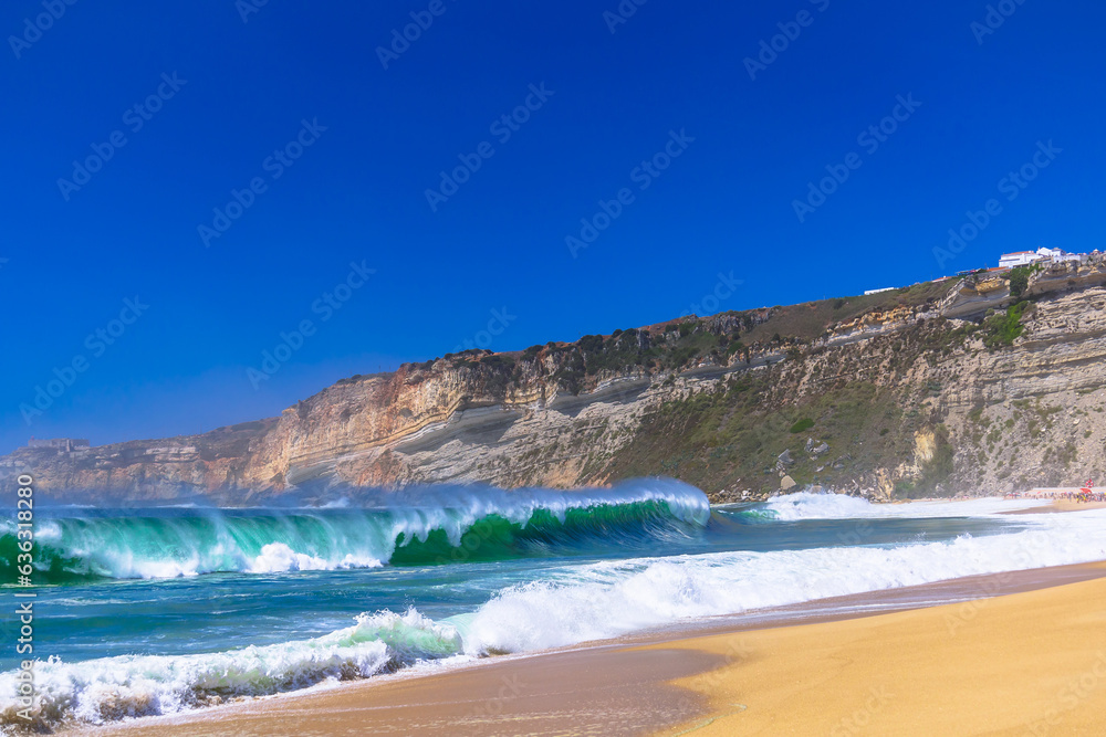 Nazare beach in Portugal, home of oonw of the biggest waves in the world. Nazare bi waves beach Nazare beach in Portugal, home of oonw of the biggest waves in the world. Nazare bi waves beach