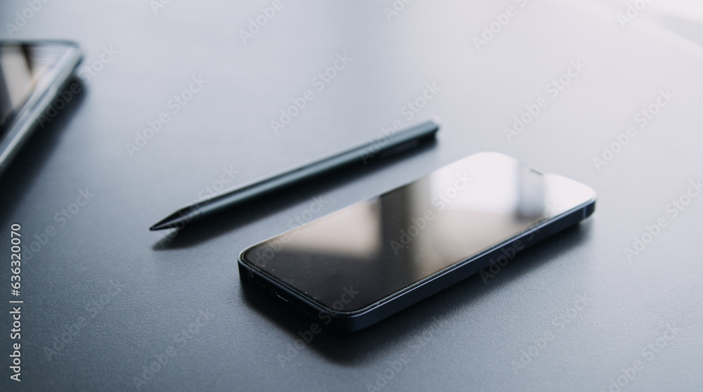 Open laptop with digital tablet and white smartphone. All with isolated screen on old wooden desk. Open laptop with digital tablet and white smartphone. All with isolated screen on old wooden desk.