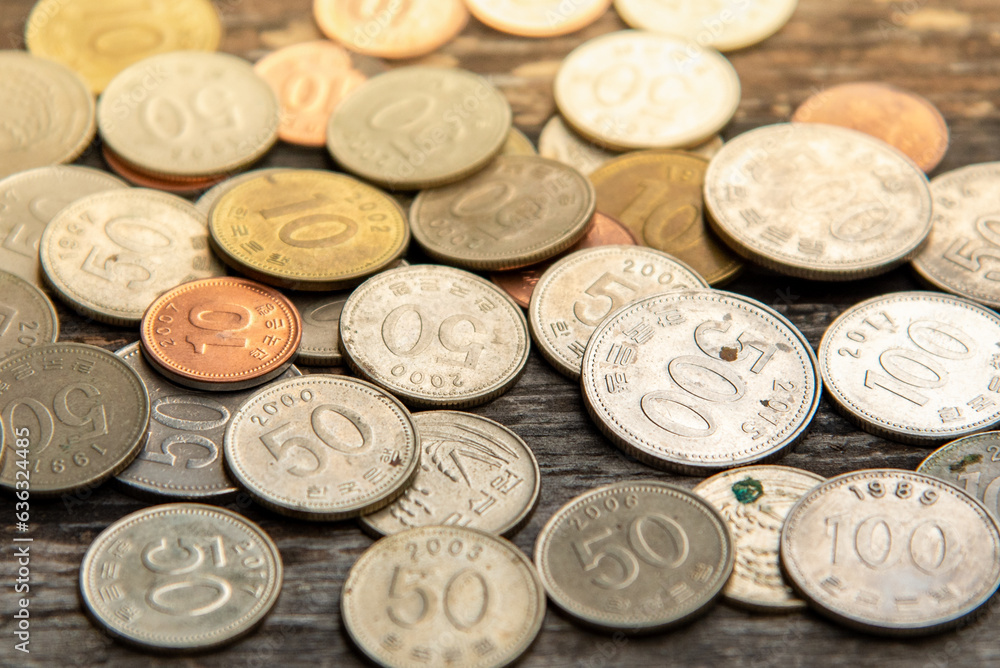 Korean coins placed on a wooden table Korean coins placed on a wooden table